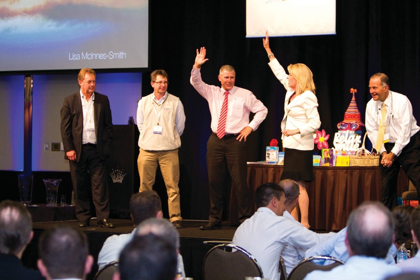 Lisa engaging a group of participants on stage